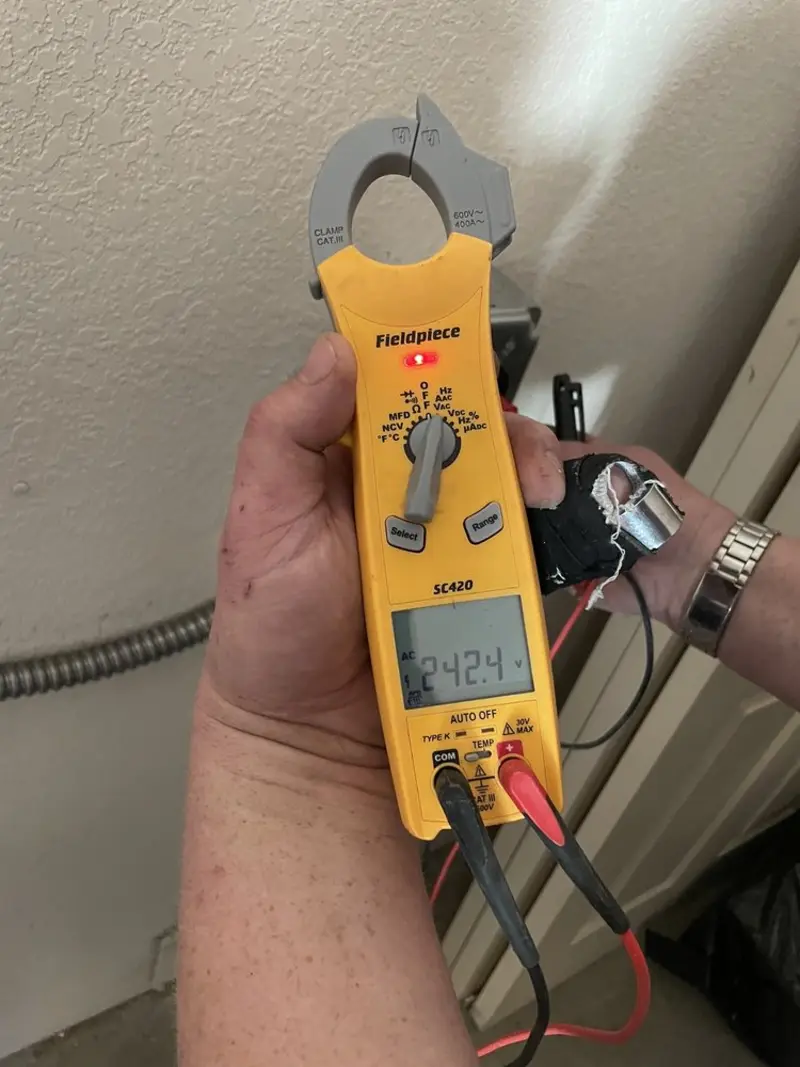 Voltage testing with clamp meter during Outlet Installation in New Carrollton